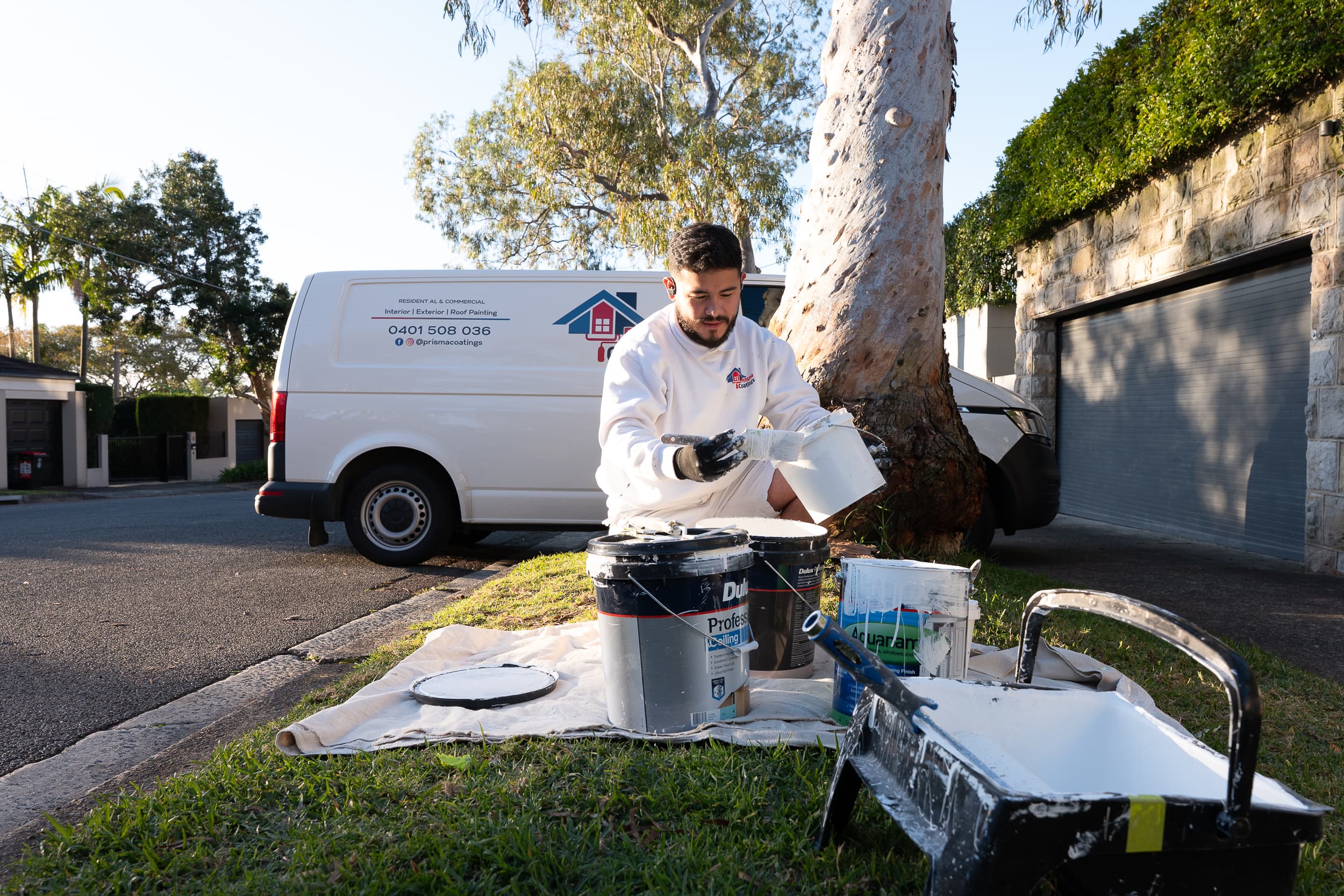 Professional painting team from Prisma Coatings working on residential project