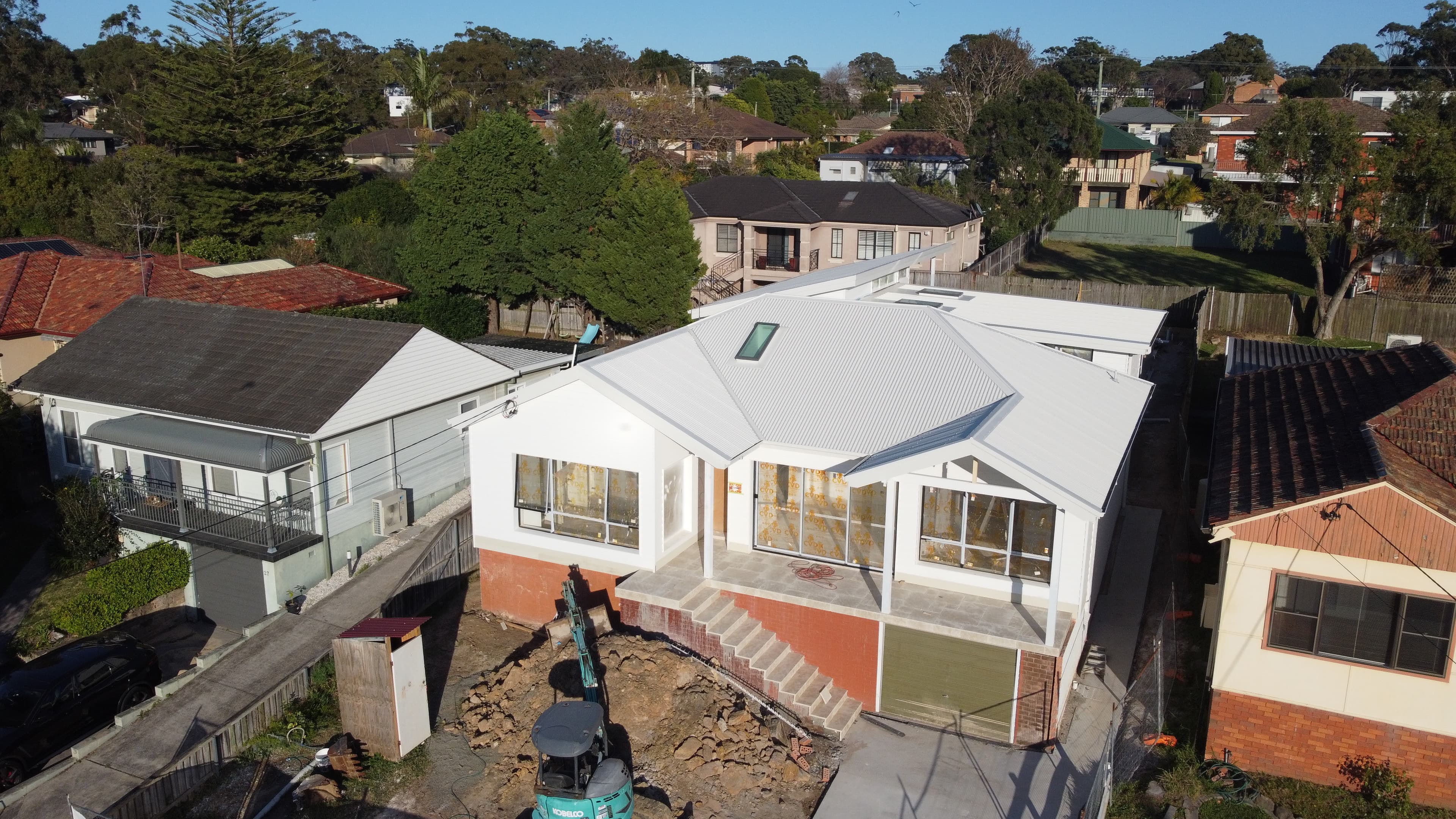 Exterior House Repainting Sydney - Before House exterior before repainting in Sydney showing unfinished renovation and construction area