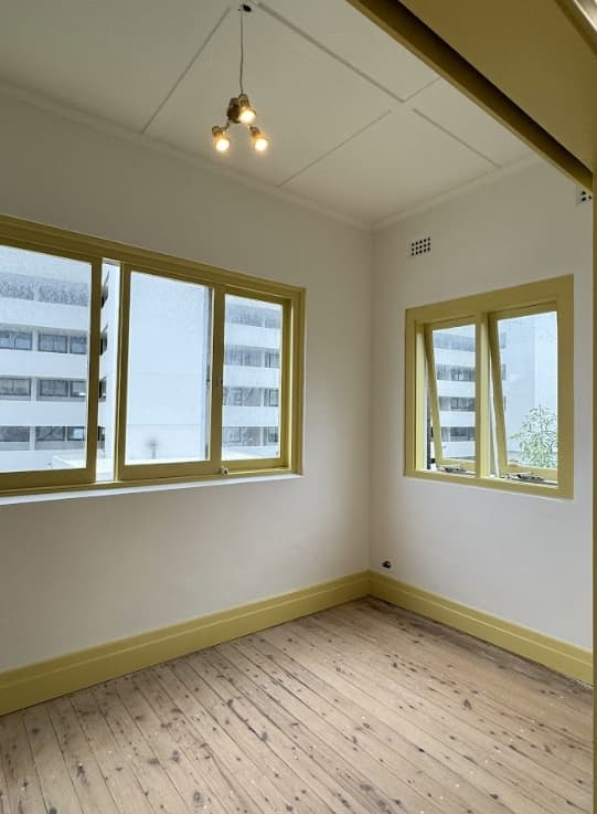 Interior Room Painting Sydney - After Interior room after professional painting in Sydney with smooth white walls and restored window frames