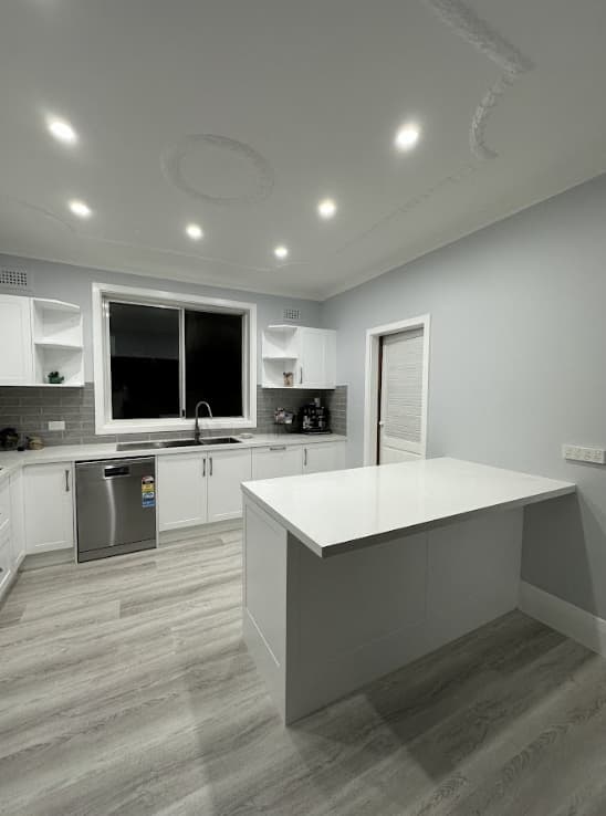 Kitchen Painting Sydney - After Kitchen after professional interior painting in Sydney with modern light grey walls and clean finish