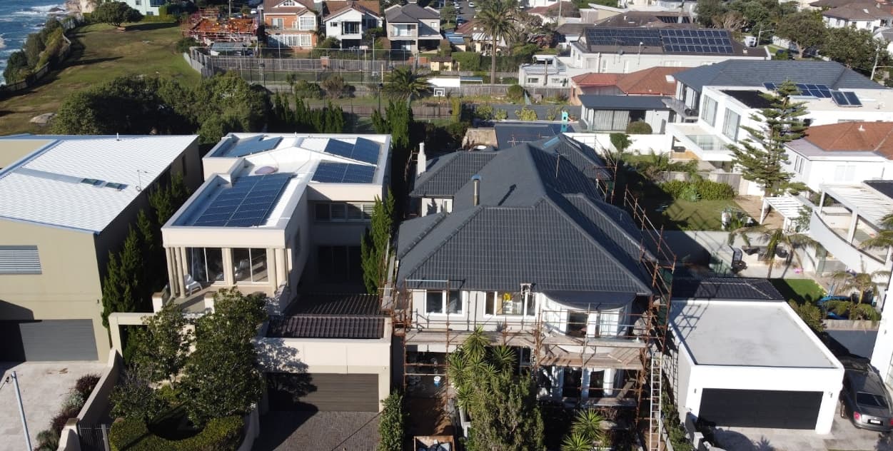 Roof Painting Sydney - After House roof after professional roof painting in Sydney with clean dark tiles and restored finish