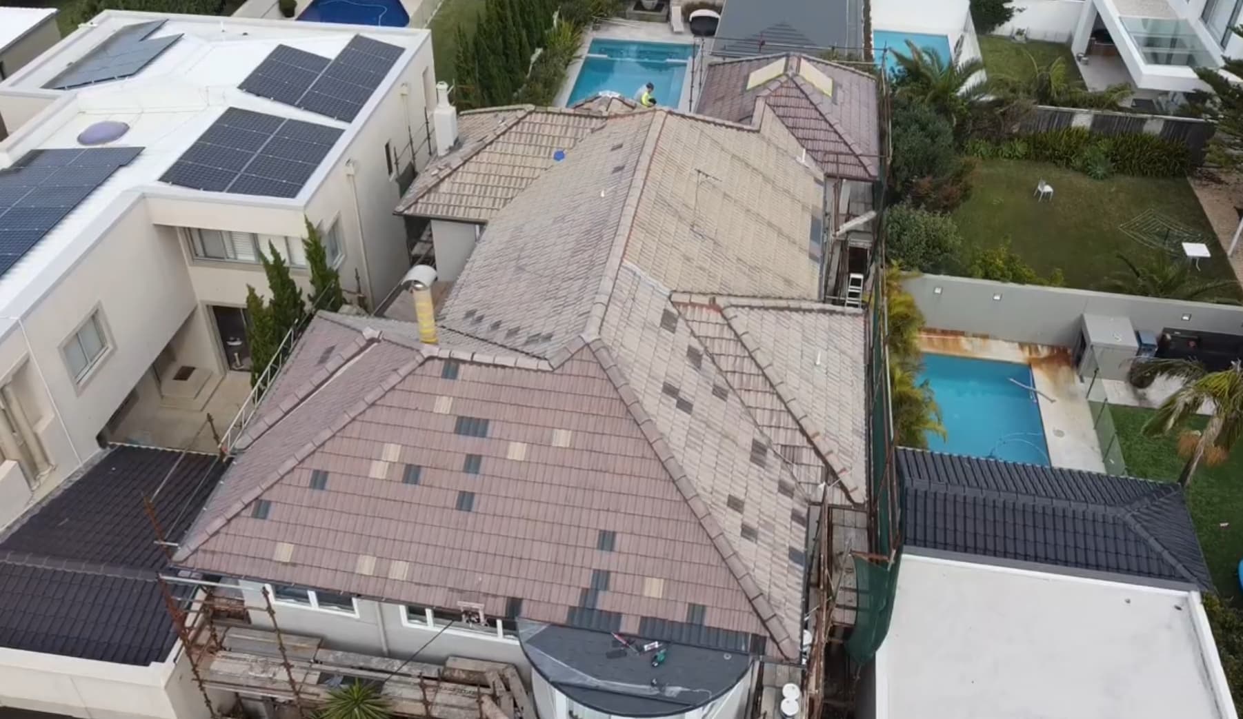 Roof Painting Sydney - Before House roof before restoration in Sydney showing faded roof tiles and weathered surface